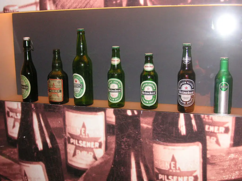 Different Sizes of Heineken bottles on an Exhibit to represent the History of Beer