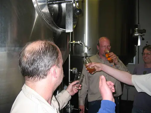 men checking quality of VICTORY BREWING COMPANY beer