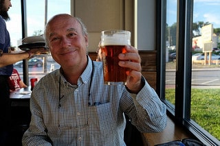 man holding a VICTORY BREWING COMPANY beer