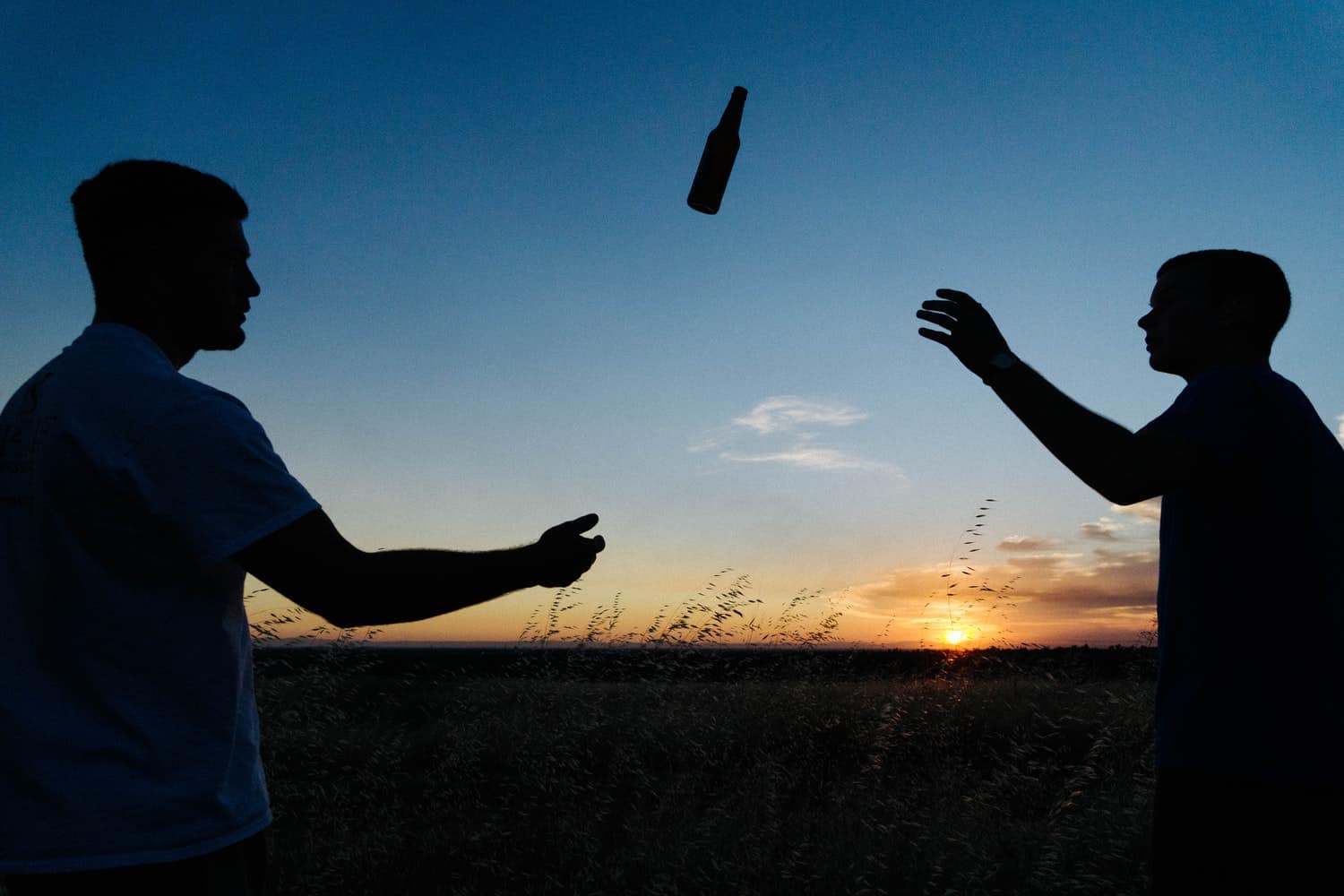 tossing a bottle of beer