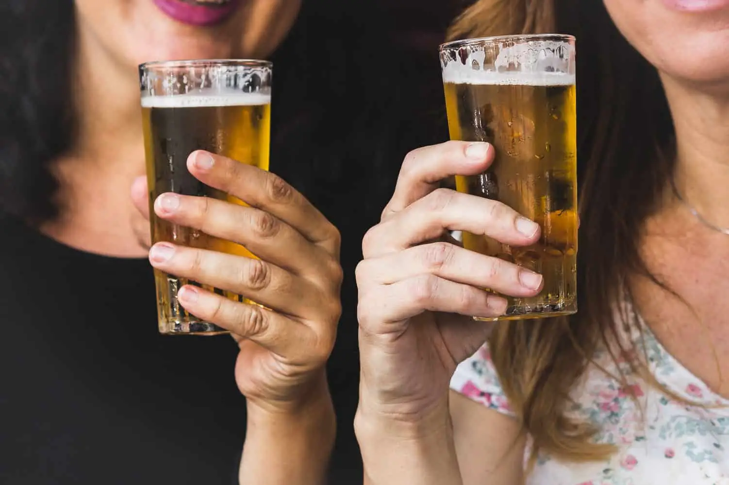 two lady drinking beer