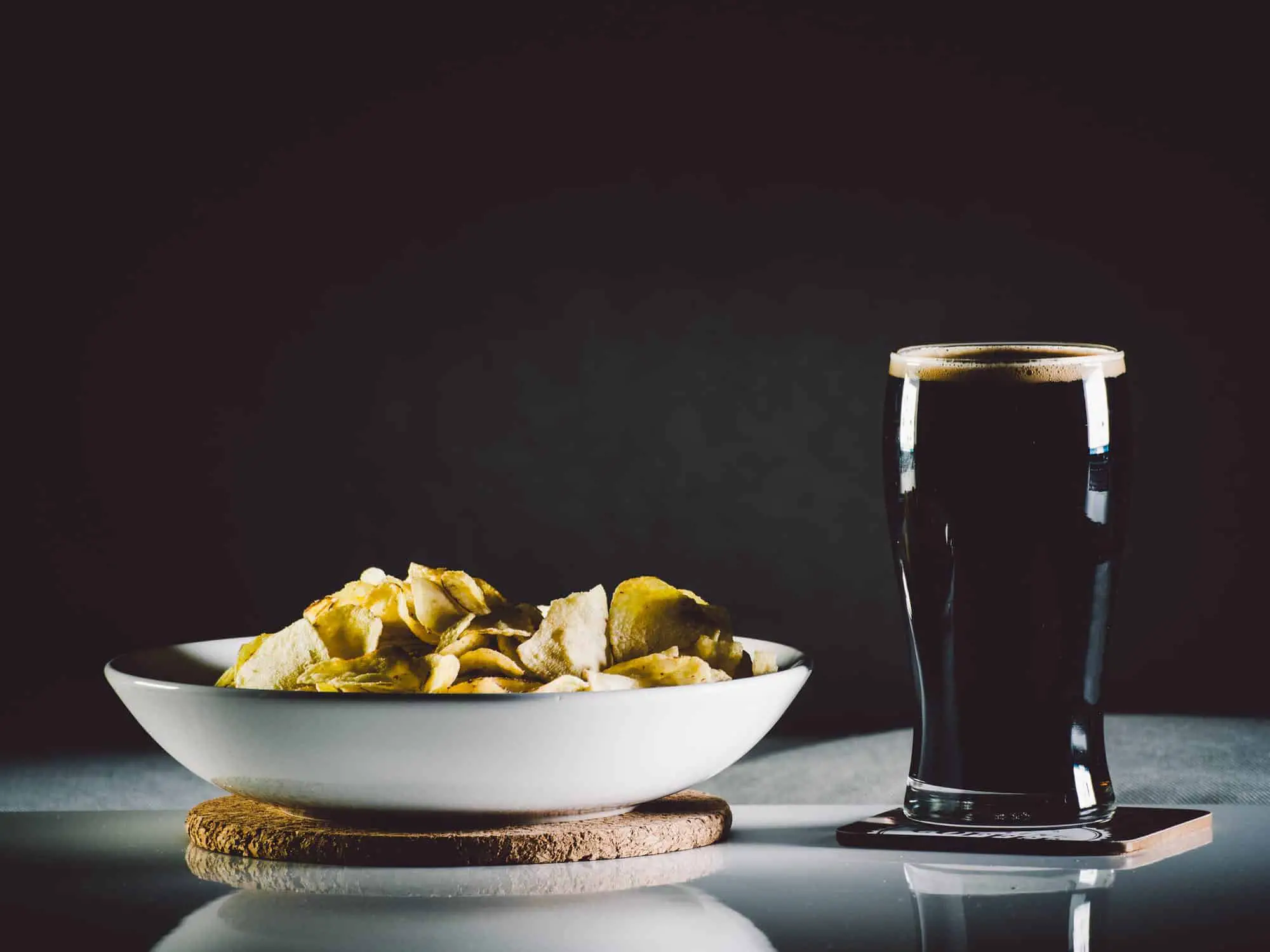 dark beer on table with chips; types of beer